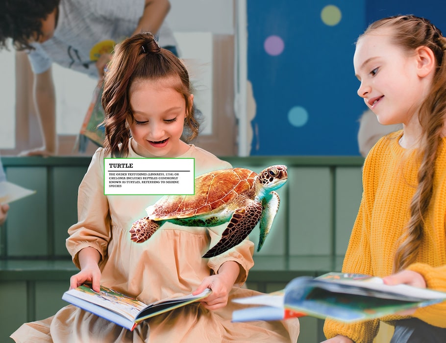Two children in of an AR experience on a school book